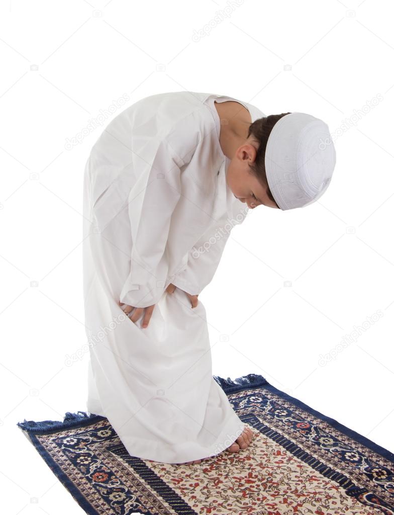 Muslim young boy praying