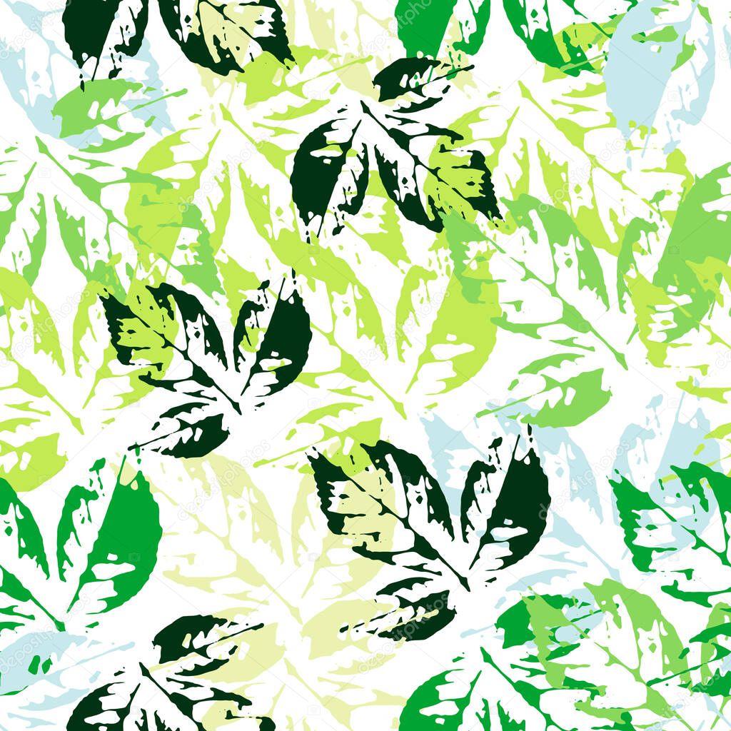 Seamless pattern of leaf prints. Stylish wallpaper of colorful leaves. Colorful leaves prints on a white background.