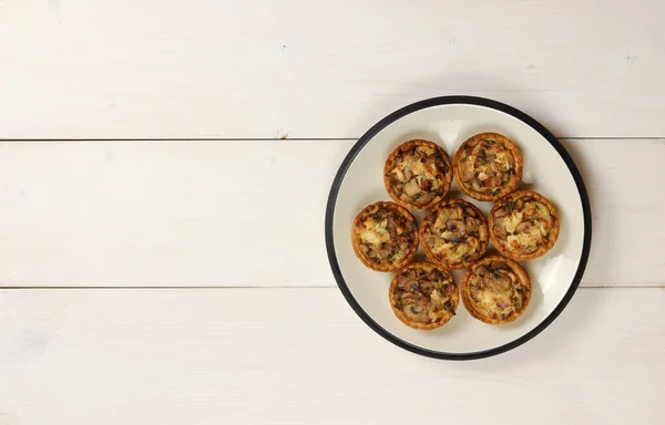 Julienne with mushrooms in tartlets on a plate — Stock Image Julienne Mushrooms Tartlets Plate Stock Image
