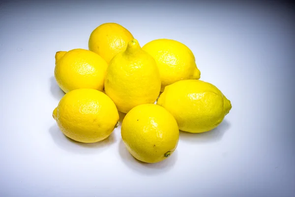 Fresh lucky seven lemons in light — Stock Photo, Image