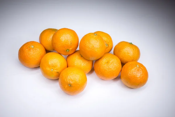 Real fresh tangerines painted with light — Stock Photo, Image