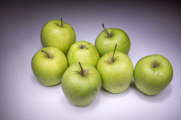 Lucky seven green apples painted with light — Stock Photo, Image