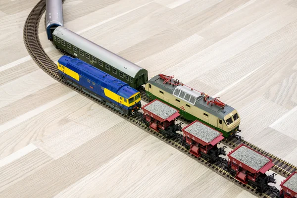 Two model trains on wooden floor, game for kids — Stock Photo, Image