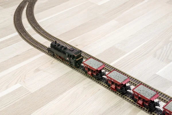 Model steam train on wooden floor, game for kids — Stock Photo, Image