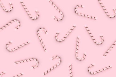 Pastel pembe desenli Noel şekerleri. Yeni yıl yaratıcı asgari konsept. Mutlu tatiller kompozisyonu.