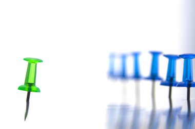 Green pin on the left and a bunch of blue pins on the right