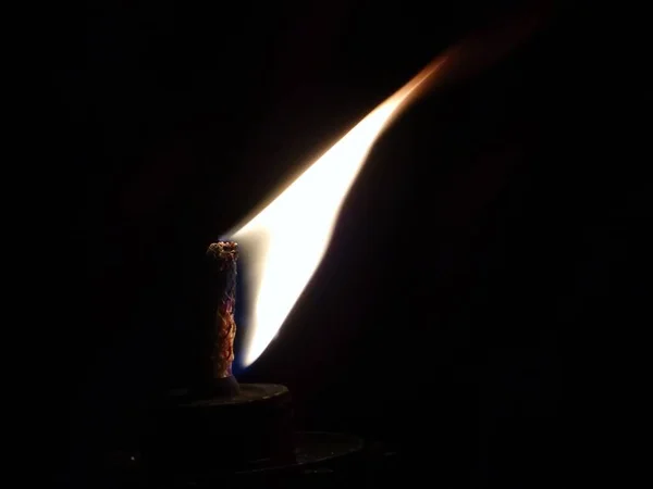 low key torch flame light isolated in black background
