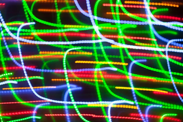 Luzes de Natal desfocadas com borrão de movimento. Bokeh de Ano Novo. Abdominais — Fotografia de Stock