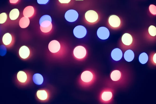 Luces de Navidad desenfocadas. Bokeh Año Nuevo. Fondo abstracto — Foto de Stock