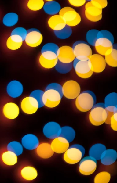 Luces de Navidad desenfocadas. Bokeh Año Nuevo. Fondo abstracto — Foto de Stock
