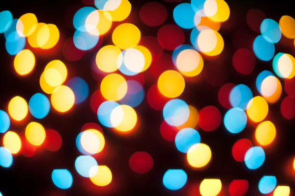 Luces de Navidad desenfocadas. Bokeh Año Nuevo. Fondo abstracto — Foto de Stock