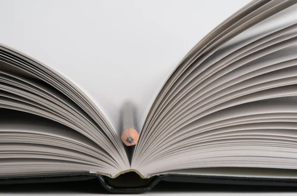 Open book with pencil — Stock Photo, Image