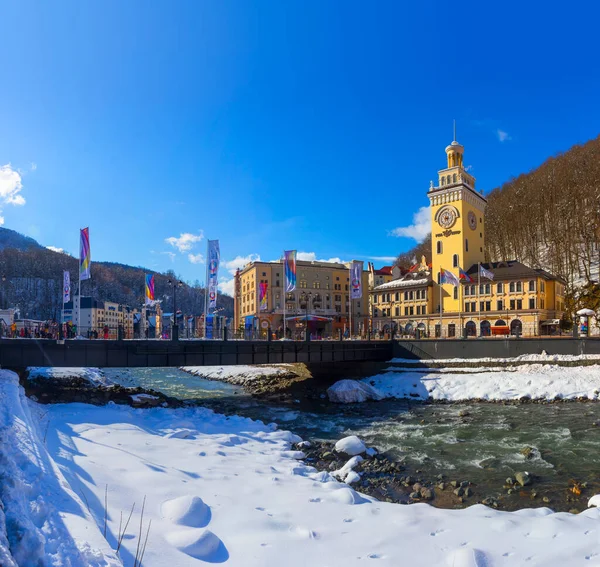 Russia, Krasnodar Region, Krasnaya Polyana, Esto-Sadok, Winter. Hotels on the banks of the Mzymta River, Bridge and flags