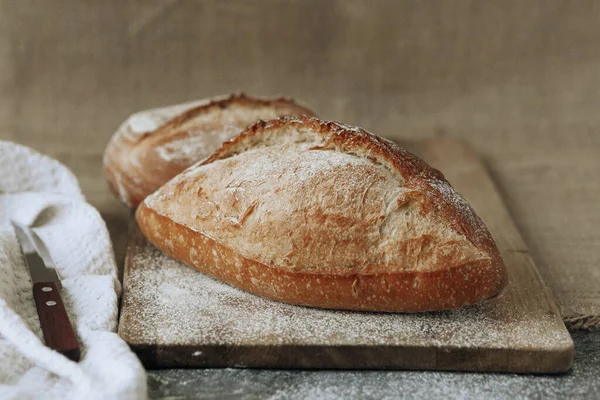 Fresh homemade crisp bread, soft focus. French bread. Bread at leaven. Unleavened bread.White textiles.