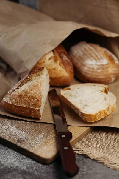 Fresh homemade crisp bread, soft focus. French bread. Bread at leaven. Unleavened bread.There is a knife for slicing bread.