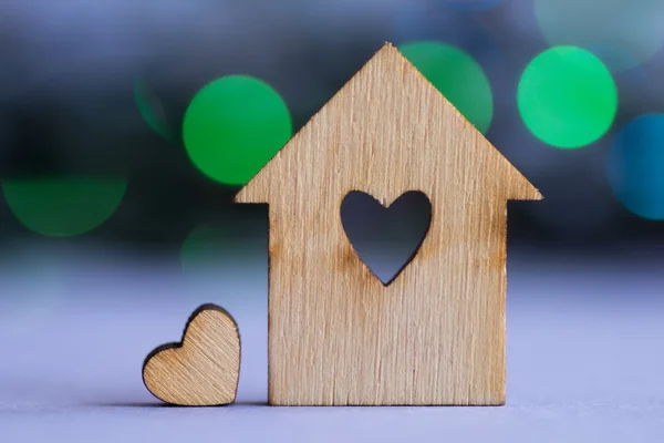 Wooden house with hole in the form of heart with little heart on — Stock Photo, Image