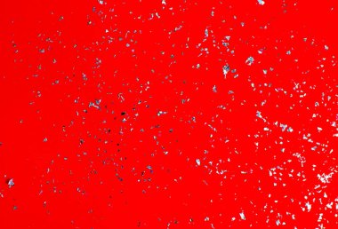 Kırmızı arka planda gümüş parıltılar. Fotoğraf seçici odak ve gürültü efektiyle çekildi