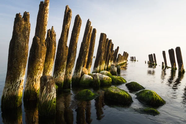 Old waterbreak with stones in pape — Stock Photo, Image