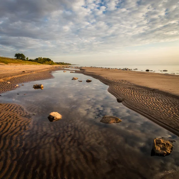Geript van zand door de zee — Stockfoto