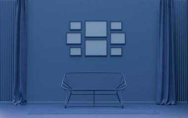 Minimalist oturma odası. Düz tek pastel, koyu mavi renkte. Duvarında 8 çerçeve, mobilya ve bitkiler var.