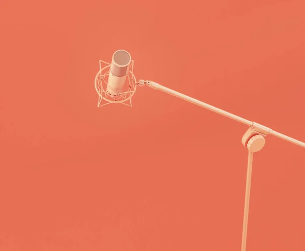 单色橙色专业基座麦克风在粉红工作室 3D渲染 — 图库照片