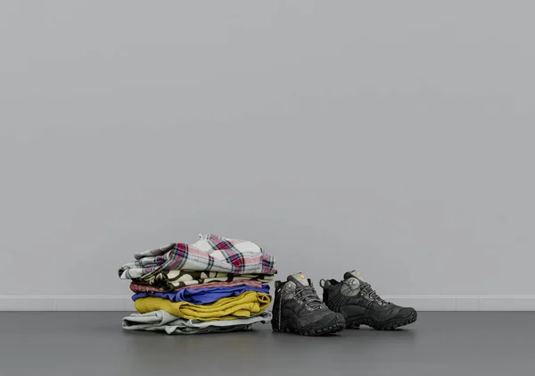 Bir Spor Ayakkabı Yerde Katlanmış Giysiler Gri Bir Odada Giysi — Stok fotoğraf