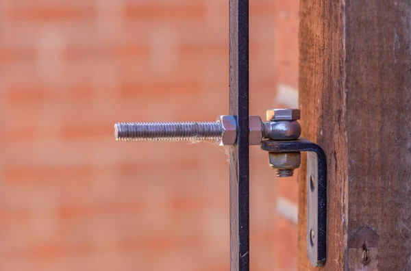 Black Ironwork Hinge Bold Gate Close Detail Blurred Red Brick — Stock Photo, Image