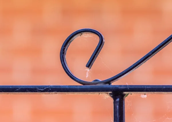 Black Ironwork Gate Close Detail Blurred Red Brick Background — Stock Photo, Image