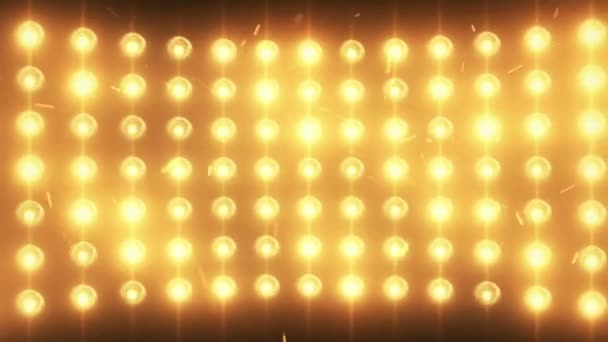 Helle Flutlichter Hintergrund mit Teilchen und Glühen. Goldton. nahtlose Schleife. — Stockvideo