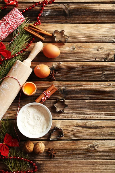 Dried oranges, cinnamon, eggs, flour and star anise — Stock Photo, Image