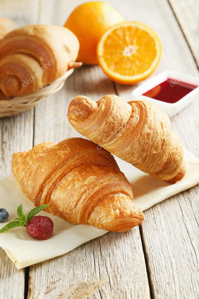 Fresh tasty croissants with berries