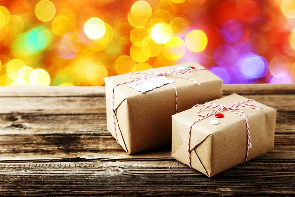 Beautiful gift boxes on brown — Stock Photo, Image