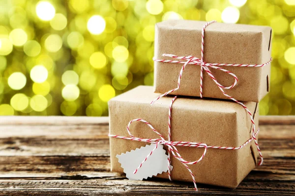 Beautiful gift boxes on brown — Stock Photo, Image