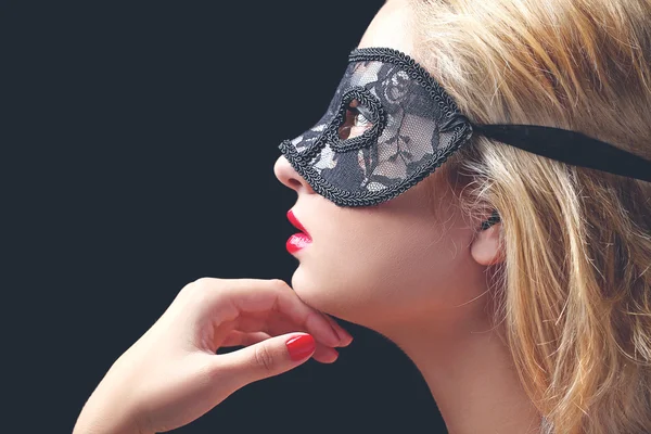 Beautiful model with black lace mask — Stock Photo, Image