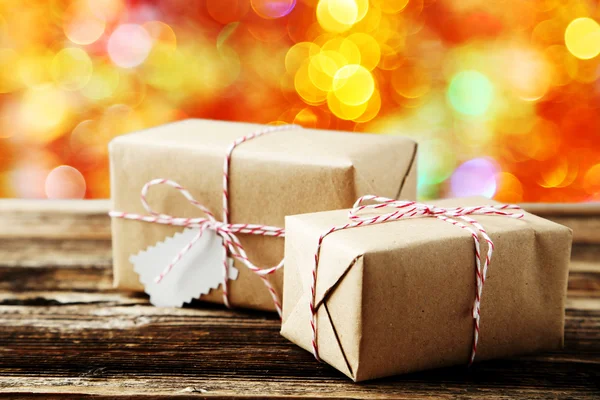 Beautiful gift boxes on brown — Stock Photo, Image