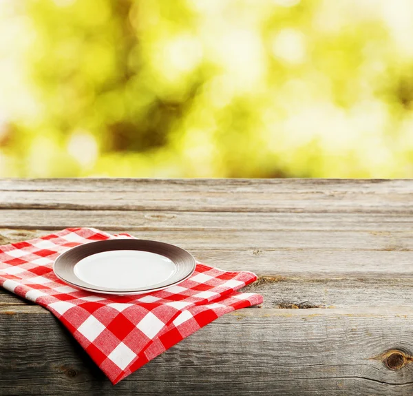 Table with white plate — Stock Photo, Image