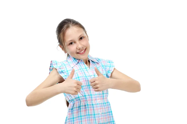 Молодая девушка поднимает большие пальцы — стоковое фото