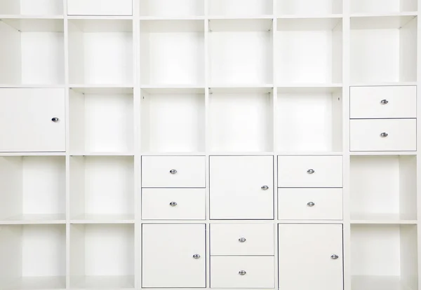 Empty shelves in white rack — Stock Photo, Image