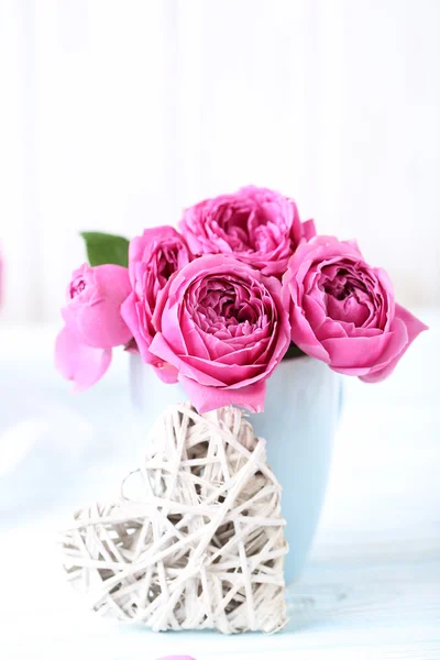 Beautiful pink roses on a white — Stock Photo, Image