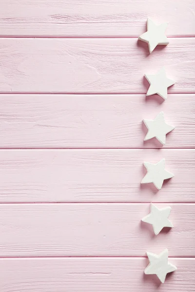 Декоративні зірки на рожевому фоні — стокове фото