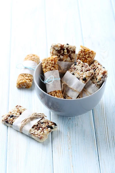 Granola bars on wooden table — Stock Photo, Image