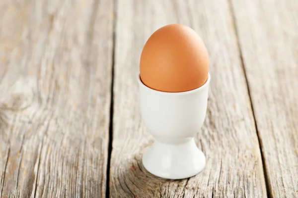 Boiled egg on wooden table — Stock Photo, Image