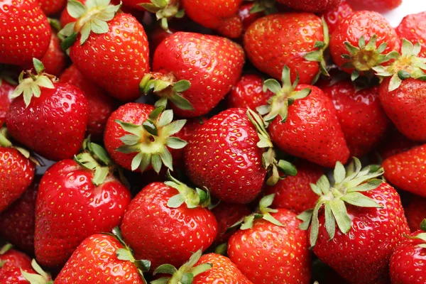 Frische und schmackhafte Erdbeeren Hintergrund — Stockfoto