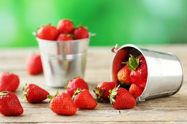 Fresh and tasty strawberries in buckets — Stock Photo, Image