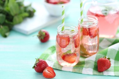 Fresh strawberry drink in bottles clipart
