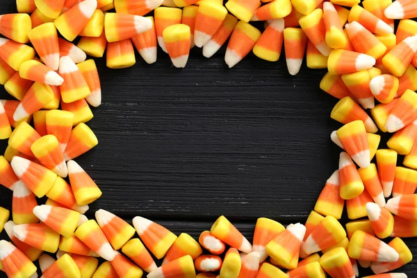 Halloween candy corns on black — Stock Photo, Image
