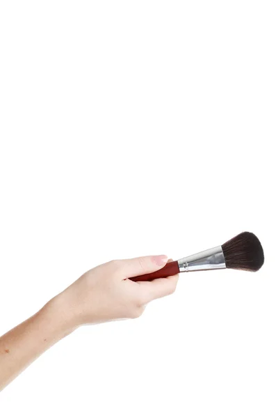 Mano femminile con pennello per trucco — Foto Stock