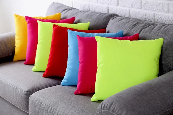 Colorful pillows on sofa — Stock Photo, Image