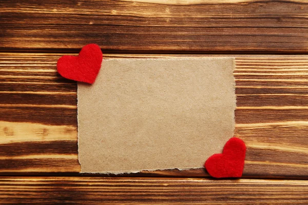 Red hearts and sheet of paper — Stock Photo, Image