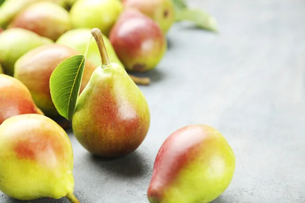 Ripe pears on grey — Stock Photo, Image